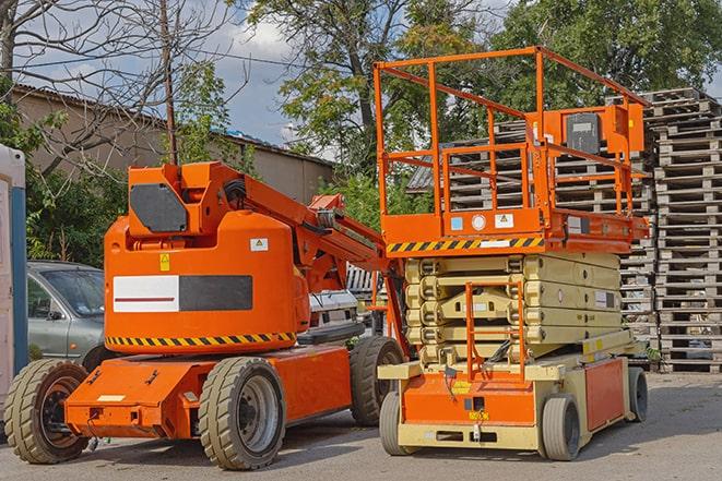 worker using forklift in industrial warehouse in Center Moriches